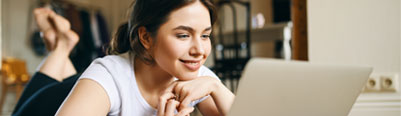 Young woman looking at laptop