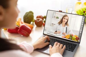 Two women discussing nutrition over video chat
