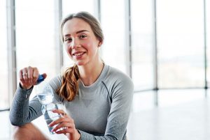 healthy fit young women with water